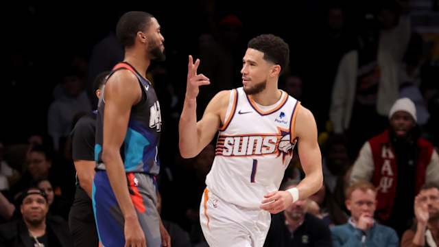Phoenix Suns guard Devin Booker (1) celebrates his three point shot against Brooklyn Nets forward Mikal Bridges (1)